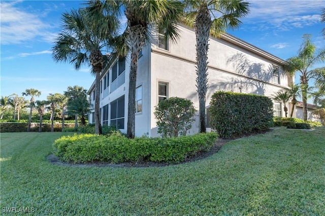 view of home's exterior featuring a lawn