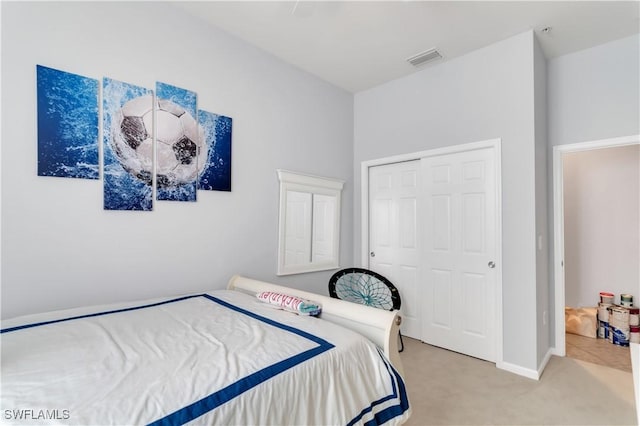 carpeted bedroom with a closet