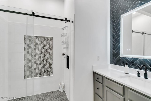 bathroom featuring vanity, walk in shower, and backsplash