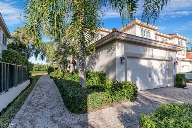 view of side of property featuring a garage