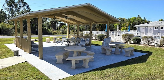 view of home's community with a lawn, a gazebo, and a patio