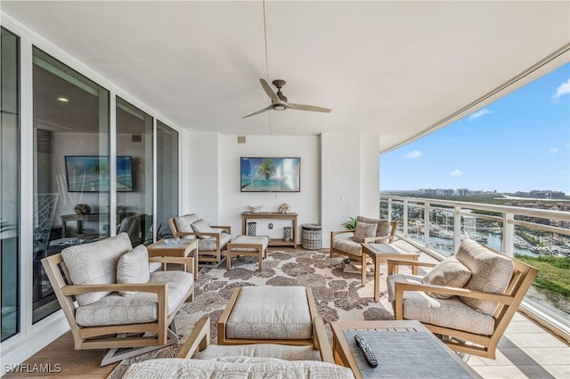 view of patio / terrace featuring outdoor lounge area, ceiling fan, and a balcony