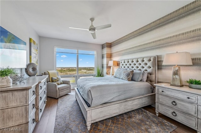 bedroom with ceiling fan and dark hardwood / wood-style flooring