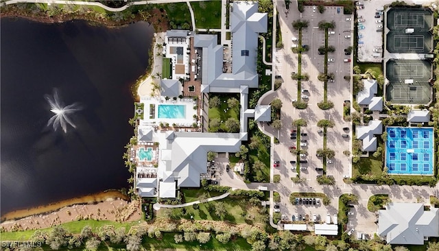 birds eye view of property with a water view