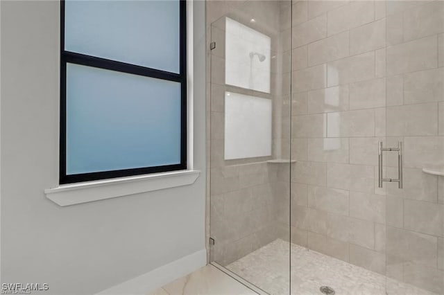 bathroom featuring an enclosed shower