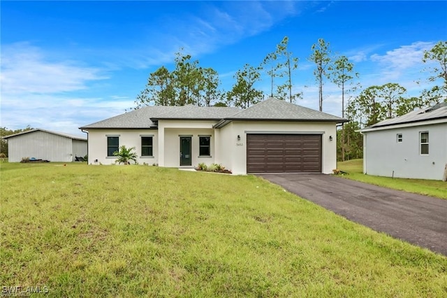 single story home with a front lawn and a garage