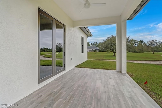 view of patio featuring ceiling fan