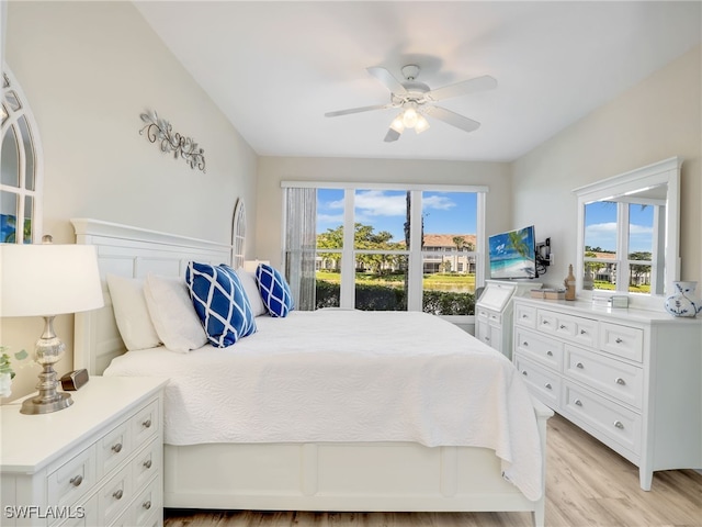 bedroom with ceiling fan and light hardwood / wood-style floors