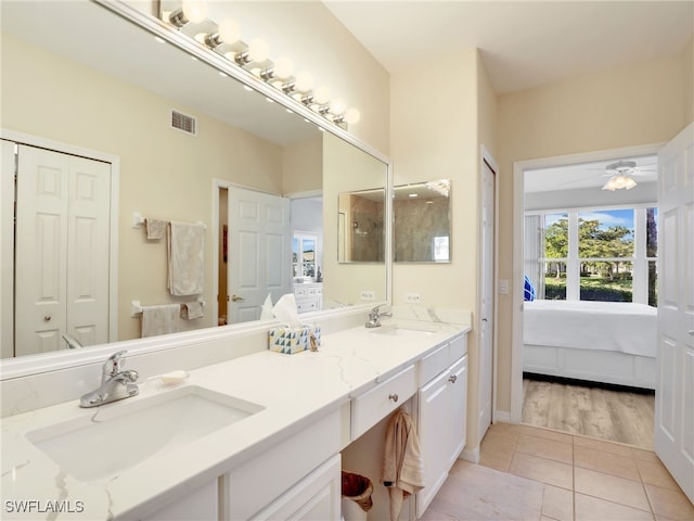 bathroom featuring vanity, tile patterned floors, and ceiling fan