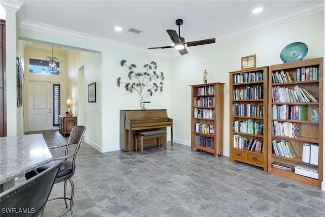 sitting room featuring ceiling fan and ornamental molding