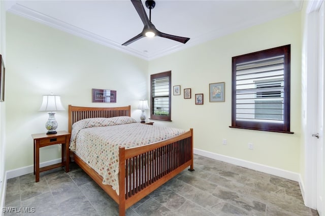 bedroom with ceiling fan and ornamental molding