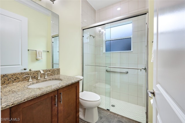 bathroom with toilet, tile patterned flooring, an enclosed shower, and vanity