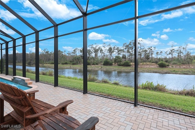 unfurnished sunroom with a water view