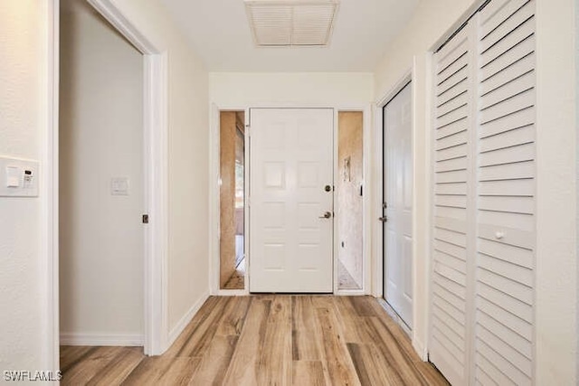 hall featuring light wood-type flooring