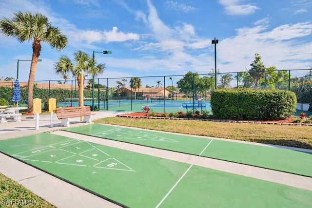 view of property's community with tennis court