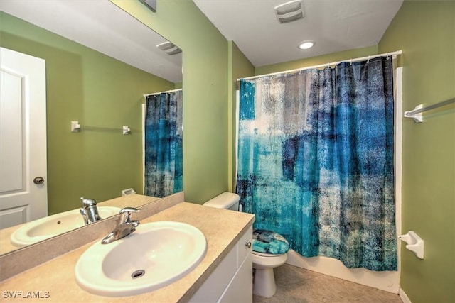 bathroom featuring tile patterned floors, walk in shower, vanity, and toilet