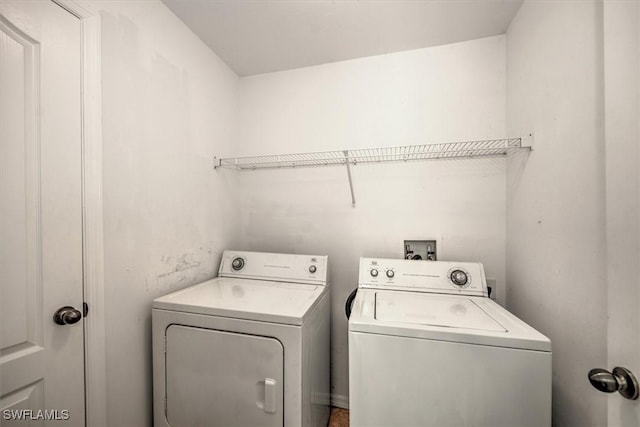 clothes washing area featuring washing machine and dryer