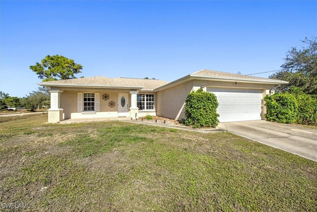 ranch-style house with covered porch, a garage, and a front lawn