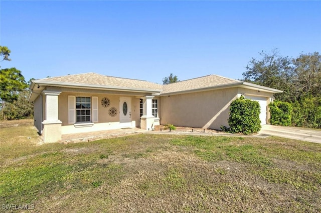 ranch-style home featuring a porch, a garage, and a front lawn