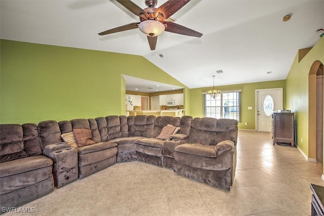 living room featuring light tile patterned floors, ceiling fan with notable chandelier, and vaulted ceiling