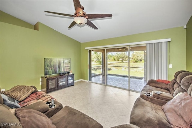 living room featuring light tile patterned floors, vaulted ceiling, and ceiling fan