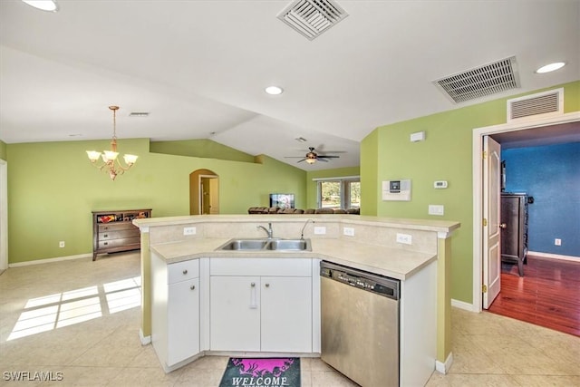 kitchen with stainless steel dishwasher, ceiling fan with notable chandelier, sink, white cabinets, and hanging light fixtures