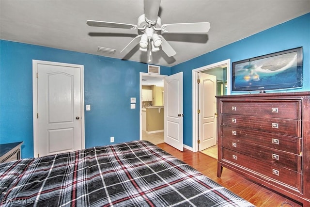 unfurnished bedroom with hardwood / wood-style floors and ceiling fan