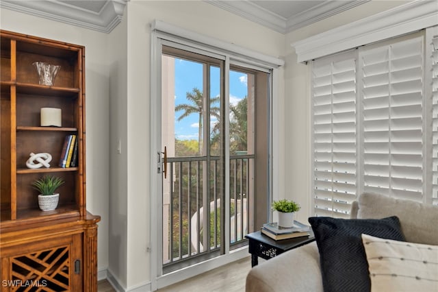 sitting room featuring crown molding