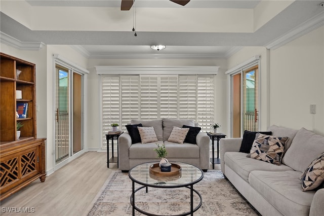 living room with ornamental molding and wood-type flooring