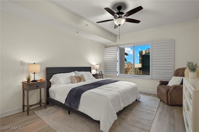 bedroom featuring ceiling fan and light hardwood / wood-style floors