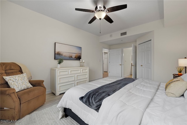 bedroom featuring ceiling fan and light hardwood / wood-style flooring