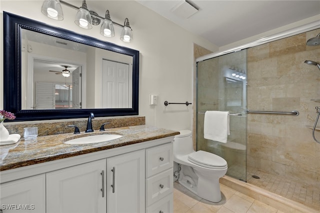 bathroom with toilet, tile patterned flooring, an enclosed shower, ceiling fan, and vanity