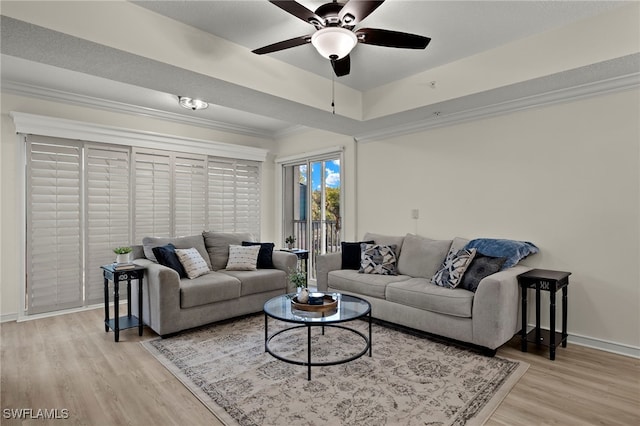 living room with ceiling fan and light hardwood / wood-style flooring