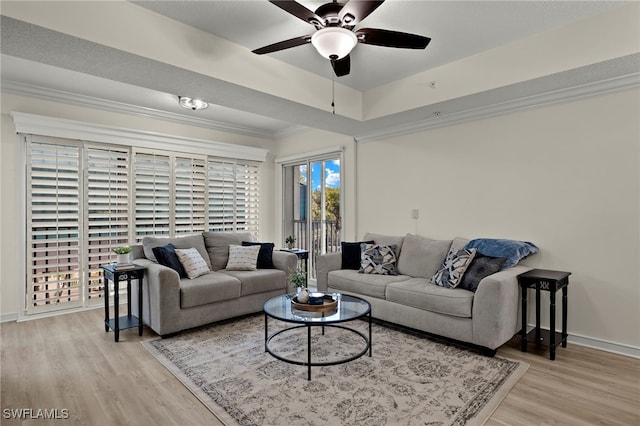 living room with ceiling fan and light hardwood / wood-style flooring