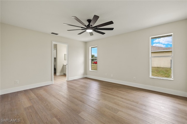 unfurnished room with ceiling fan and light hardwood / wood-style floors