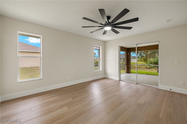 spare room featuring ceiling fan and light hardwood / wood-style floors