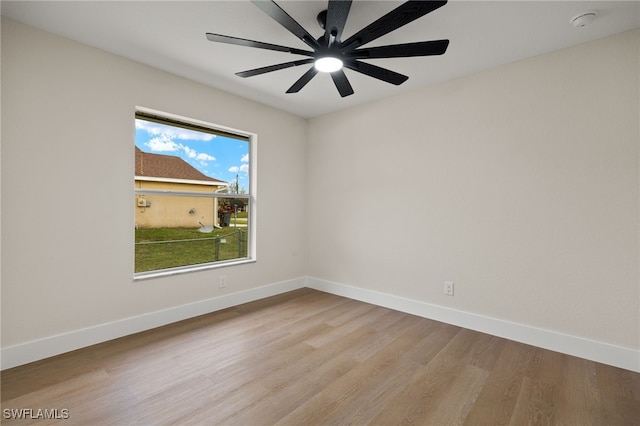 spare room featuring ceiling fan and light hardwood / wood-style flooring