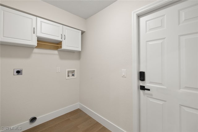 washroom featuring washer hookup, cabinets, wood-type flooring, and electric dryer hookup