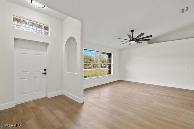 foyer with ceiling fan, vaulted ceiling, and light hardwood / wood-style floors