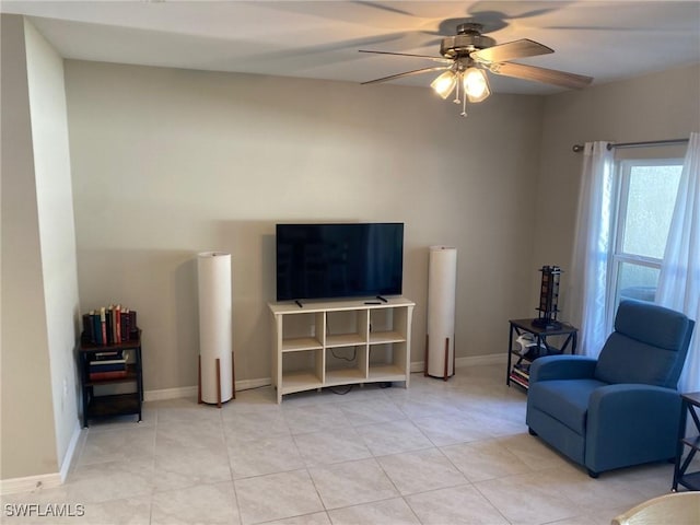 tiled living room with ceiling fan