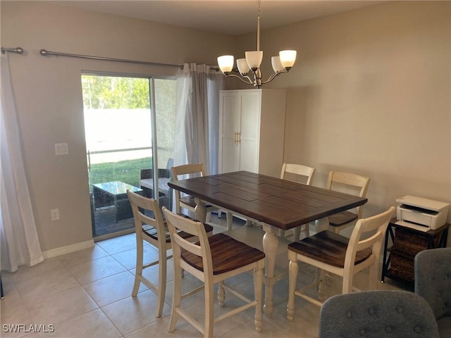 tiled dining space with a notable chandelier