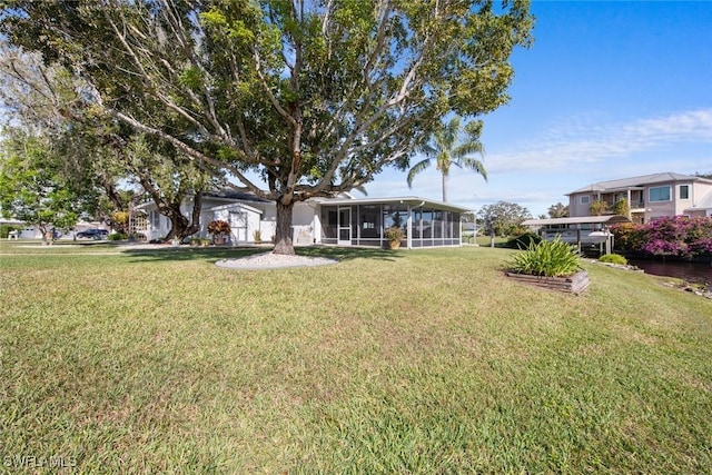 view of yard featuring a sunroom