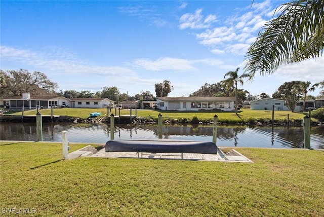 dock area featuring a yard and a water view