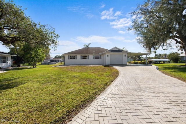 single story home featuring a carport and a front yard