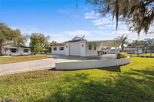 view of front of house featuring a front lawn and a carport