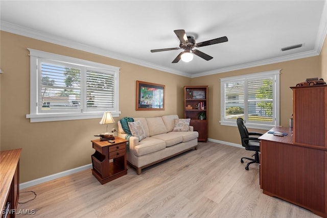 home office featuring ceiling fan, crown molding, and light hardwood / wood-style flooring