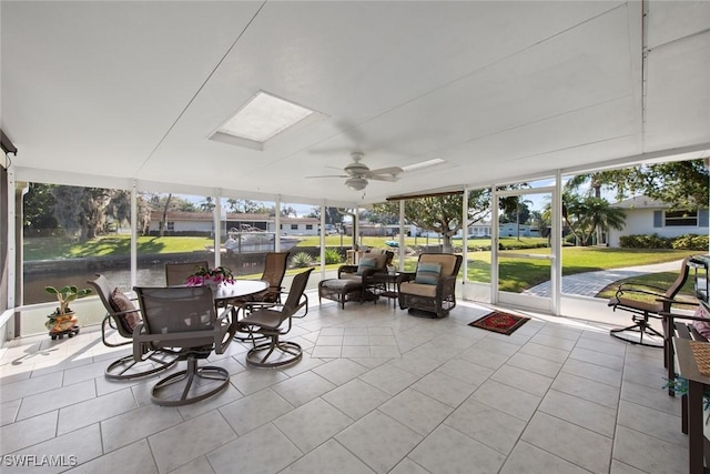 sunroom featuring ceiling fan