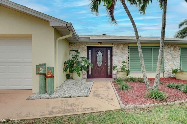 entrance to property featuring a garage