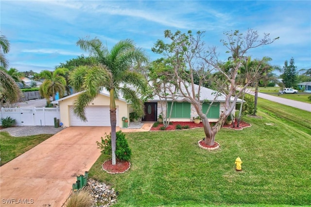 single story home featuring a front yard and a garage