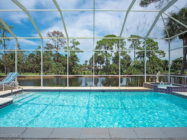 view of pool with a lanai, an in ground hot tub, and a water view